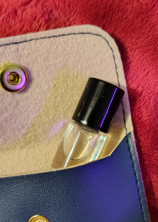 2 ml trial parfum roller bottle with black travel pouch, handmade in Sioux Falls, SD.