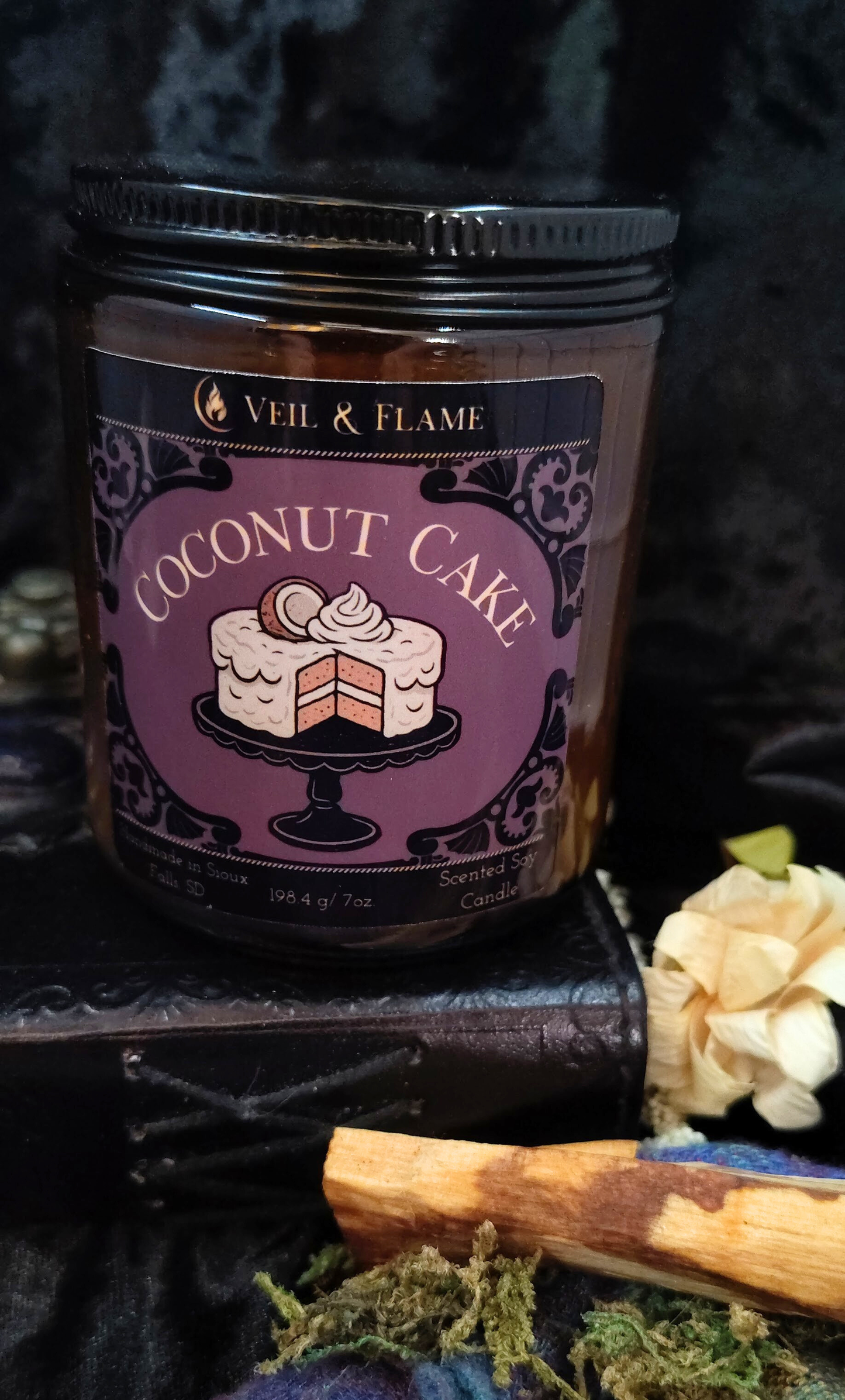 Coconut Cake candle in a 7 oz amber jar, handmade in Sioux Falls, SD with coconut milk, caramel, and vanilla scent notes.