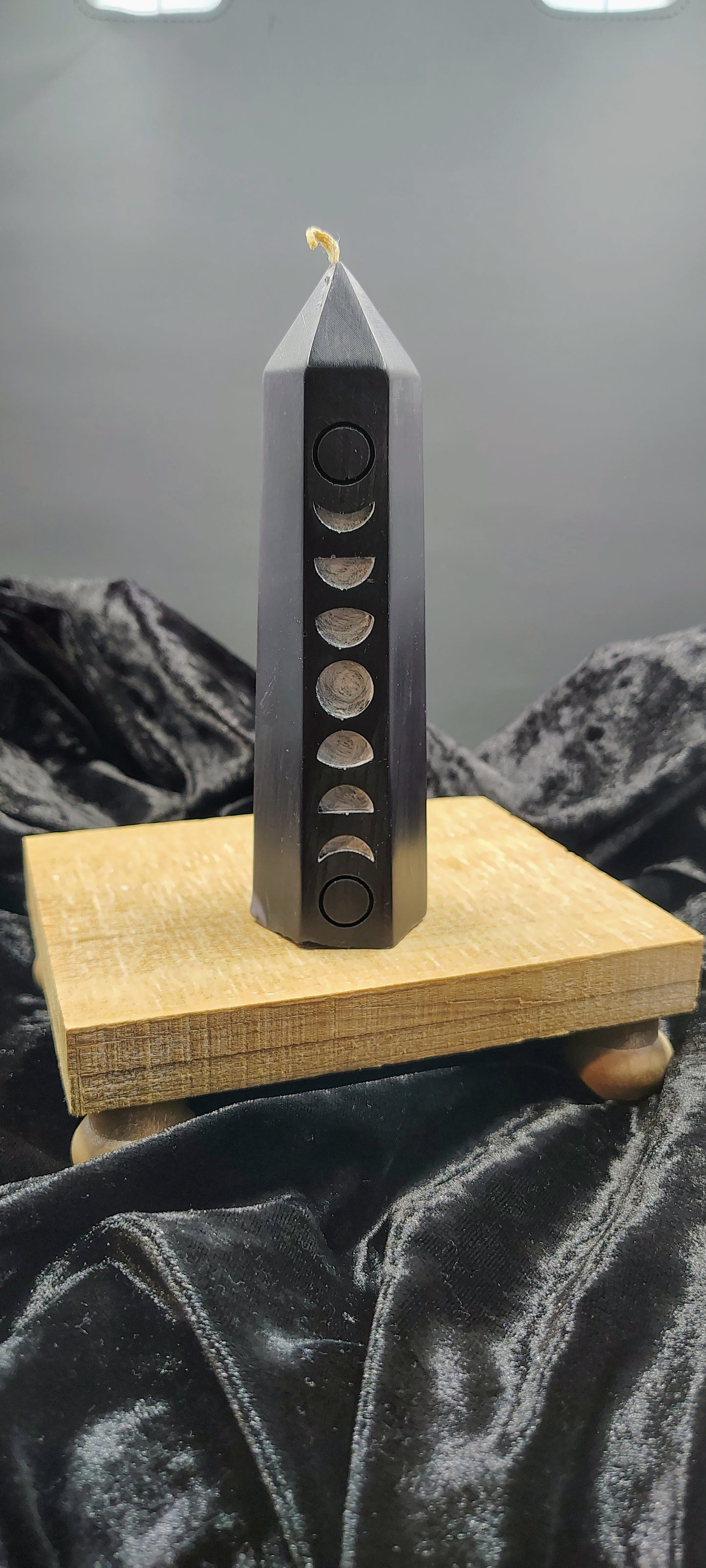 6‑inch moon phase tower candle with carved lunar design, handmade in Sioux Falls, SD.