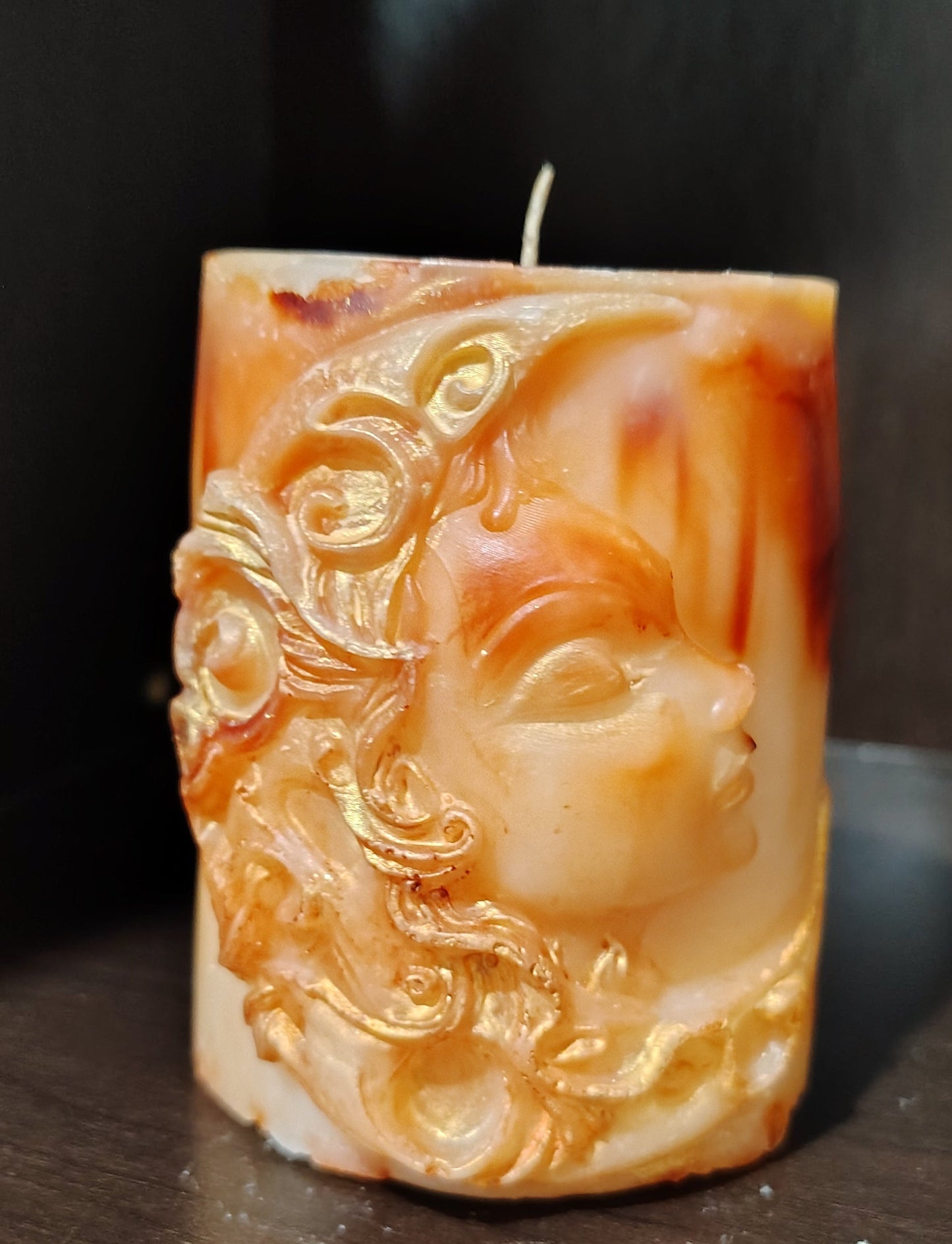 Sculptural moon‑themed feminine figure candle with marbled wax and gold detailing, handmade in Sioux Falls, SD.