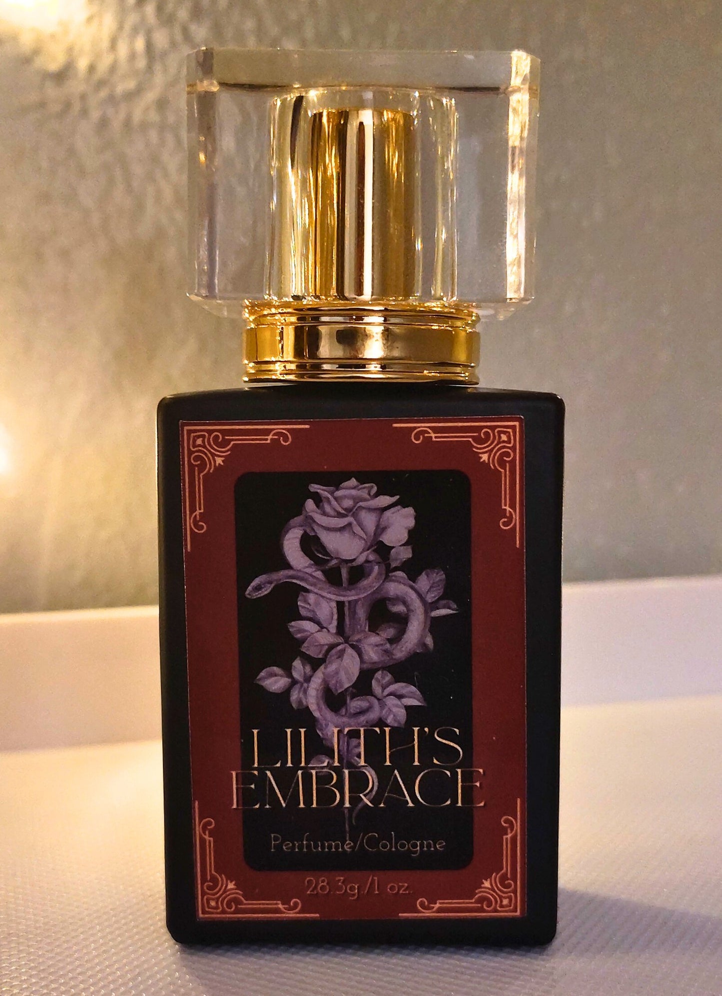 Lilith’s Embrace perfume in a 1 oz glass bottle, handcrafted in Sioux Falls, SD with dark feminine scent notes.
