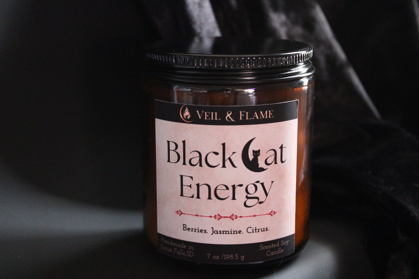 Black Cat Energy candle in a 7 oz glass vessel, handmade in Sioux Falls, SD with berry, jasmine, and citrus scent notes.