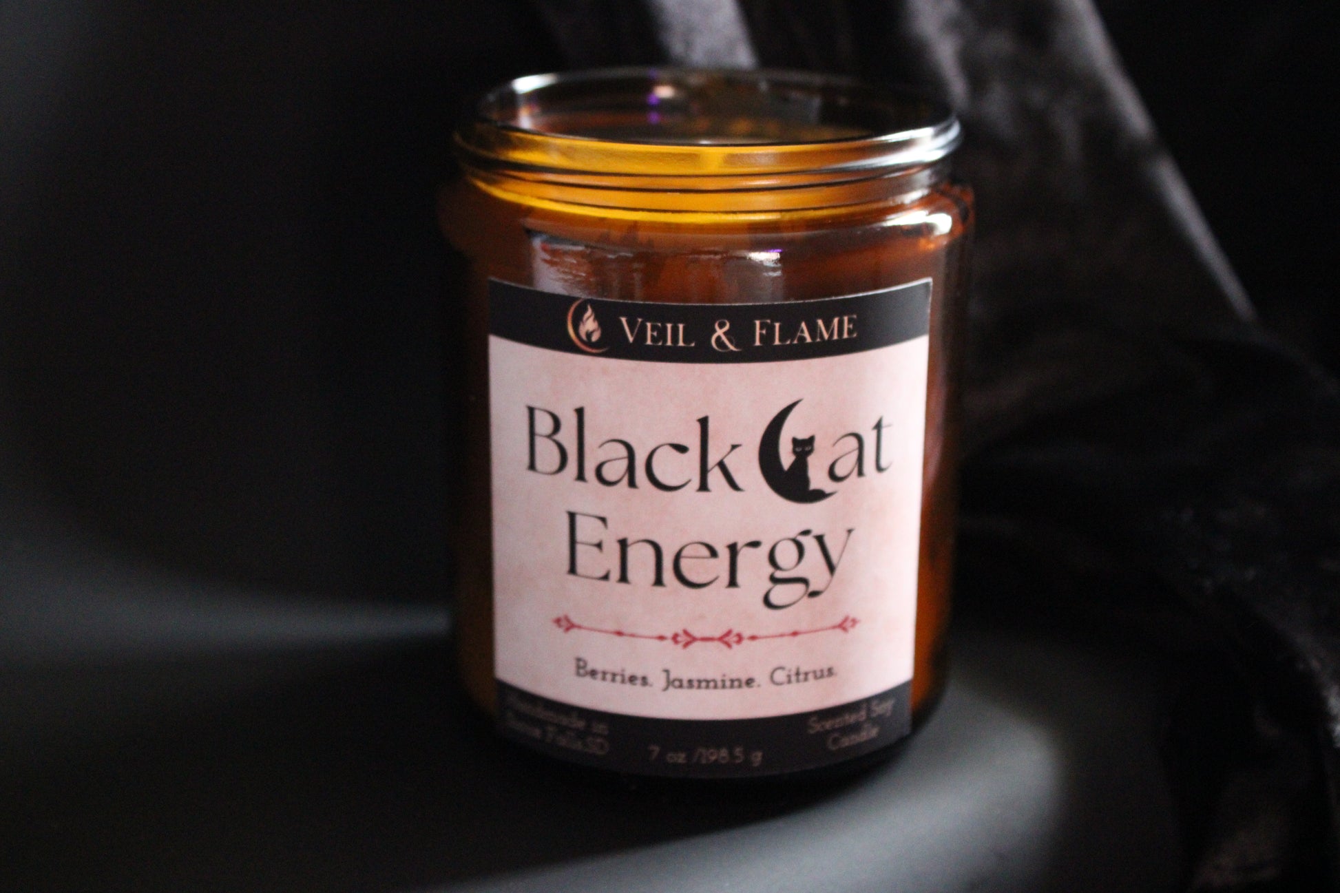 Black Cat Energy candle in a 7 oz glass vessel, handmade in Sioux Falls, SD with berry, jasmine, and citrus scent notes.