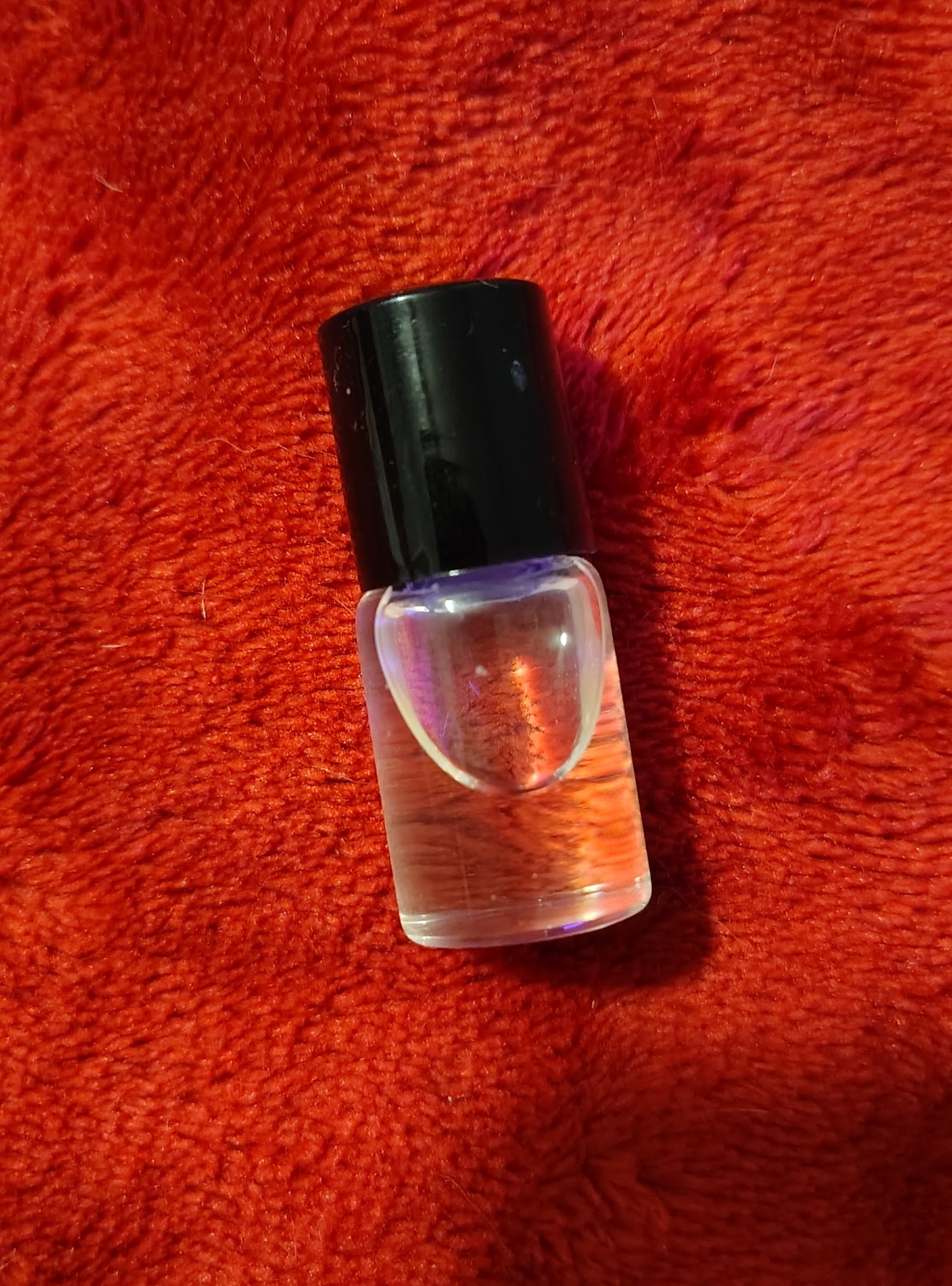 2 ml trial parfum roller bottle with black travel pouch, handmade in Sioux Falls, SD.