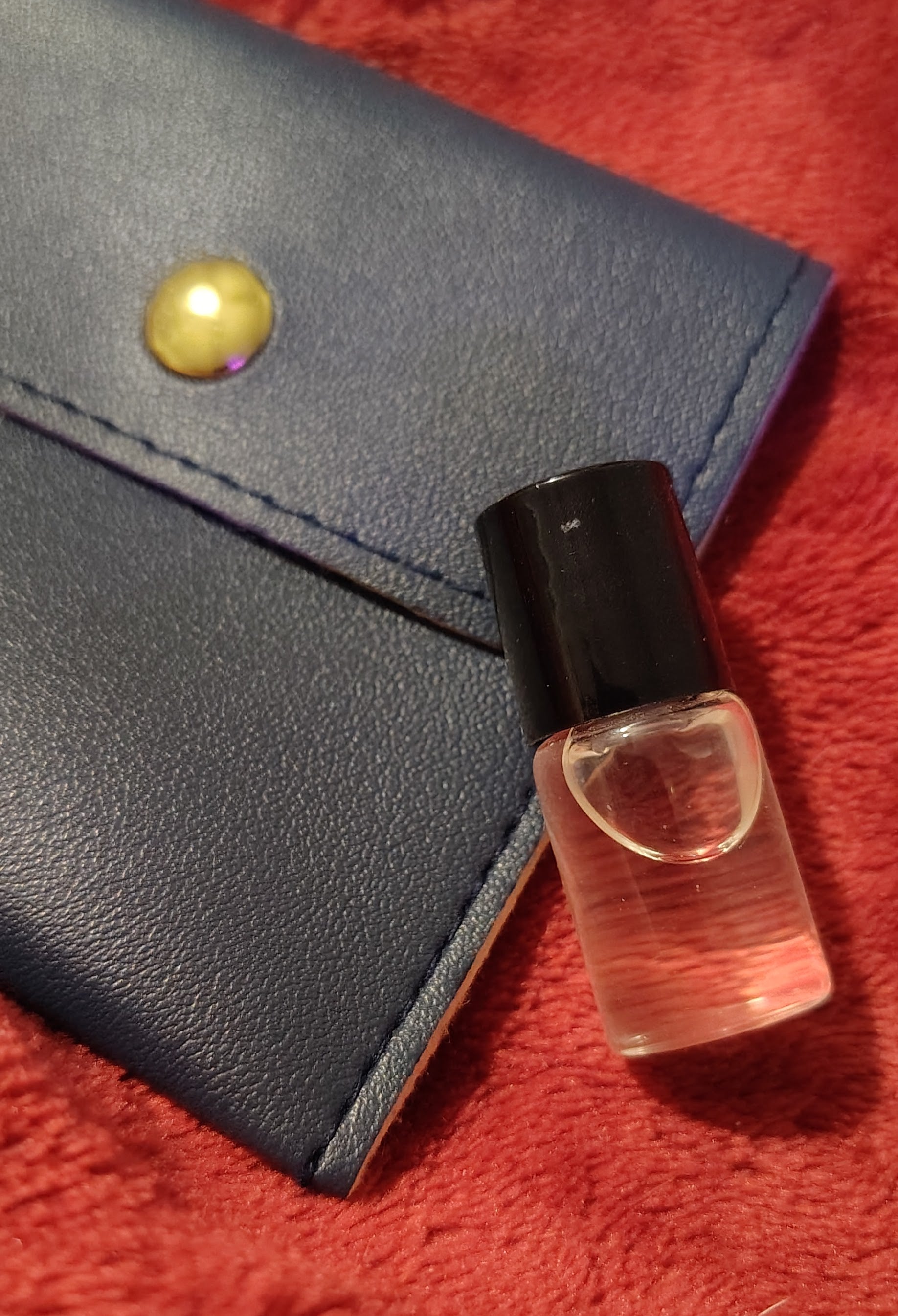 2 ml trial parfum roller bottle with black travel pouch, handmade in Sioux Falls, SD.