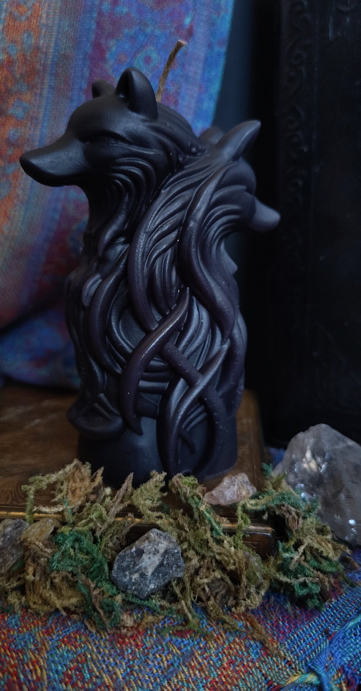 Sculptural candle featuring two intertwined wolves symbolizing duality, handmade in Sioux Falls, SD.