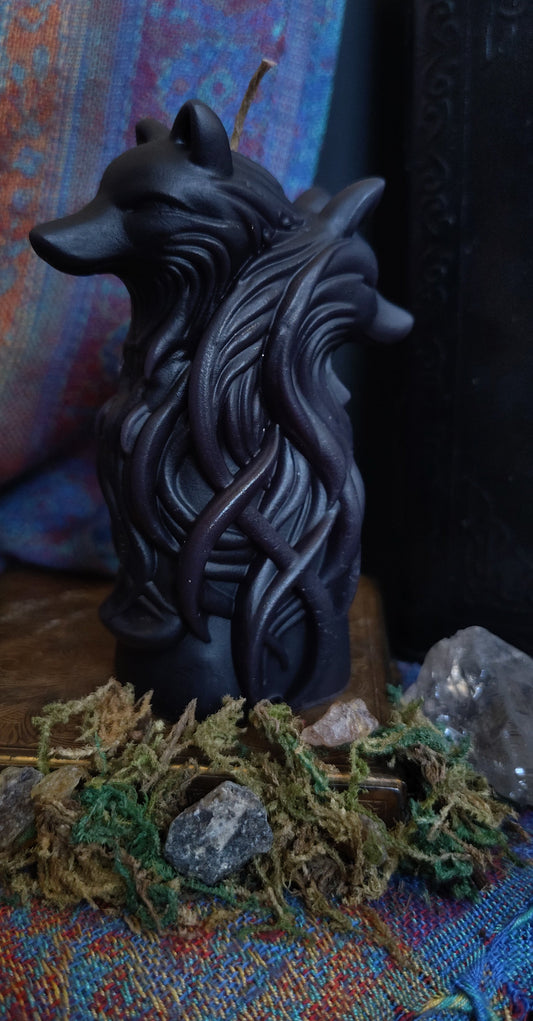 Sculptural candle featuring two intertwined wolves symbolizing duality, handmade in Sioux Falls, SD.