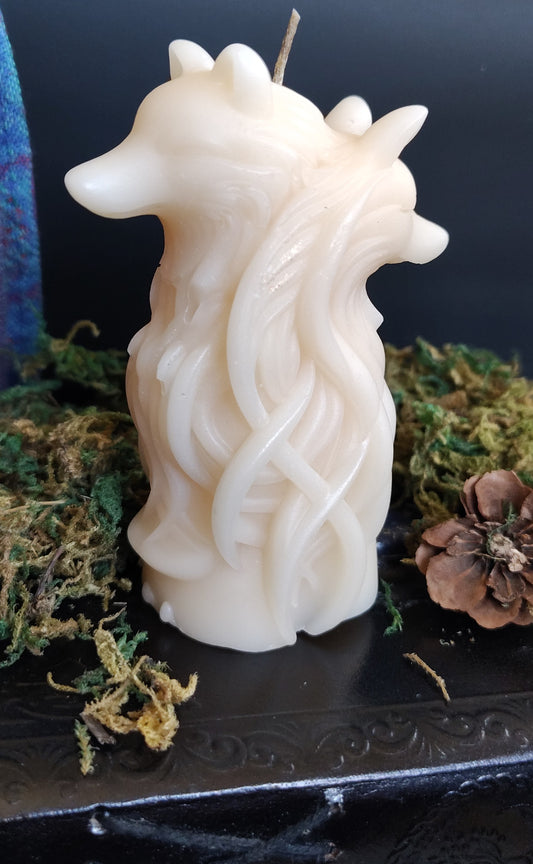 Sculptural candle featuring two intertwined wolves symbolizing duality, handmade in Sioux Falls, SD.