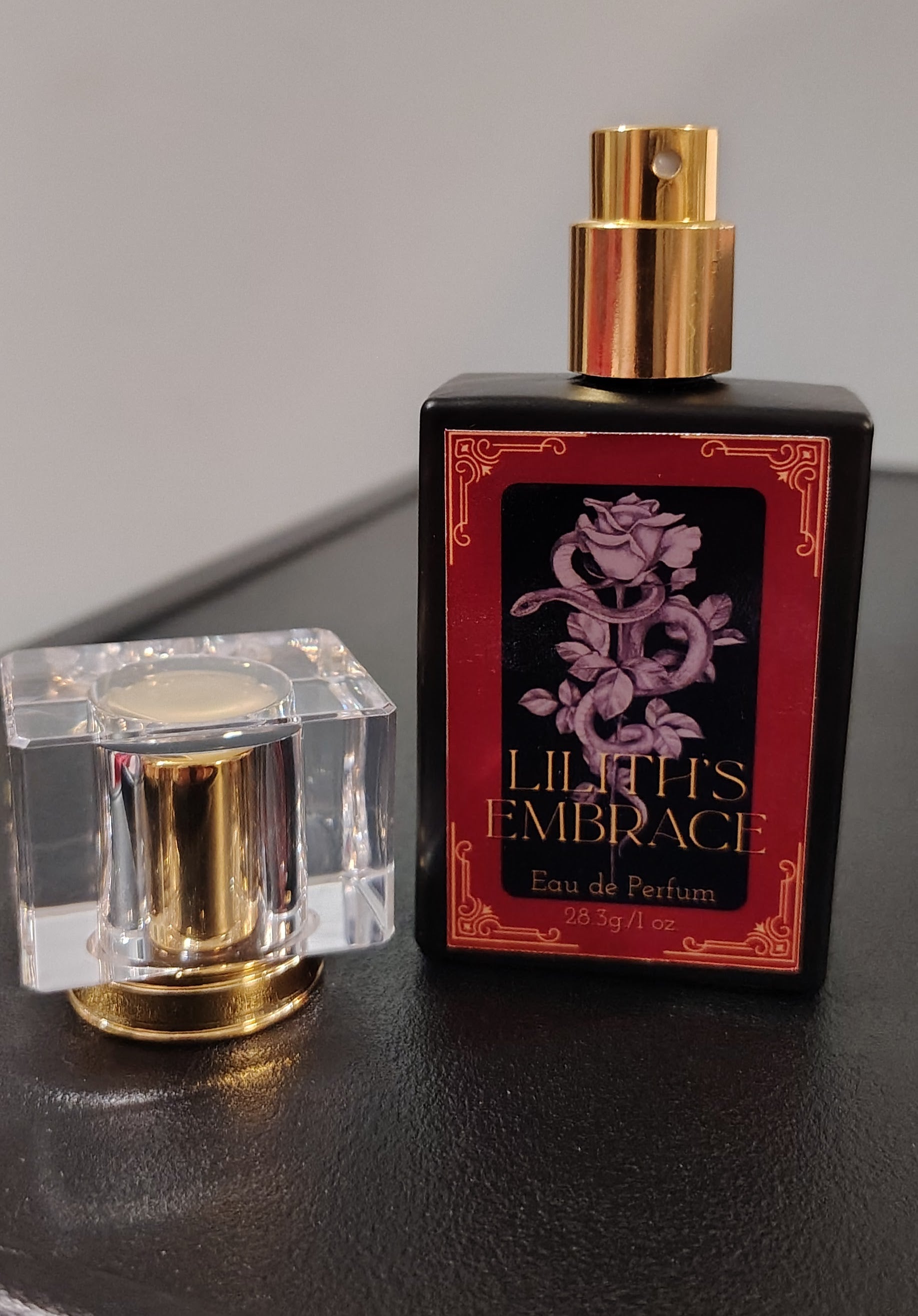Lilith’s Embrace perfume in a 1 oz glass bottle, handcrafted in Sioux Falls, SD with dark feminine scent notes.