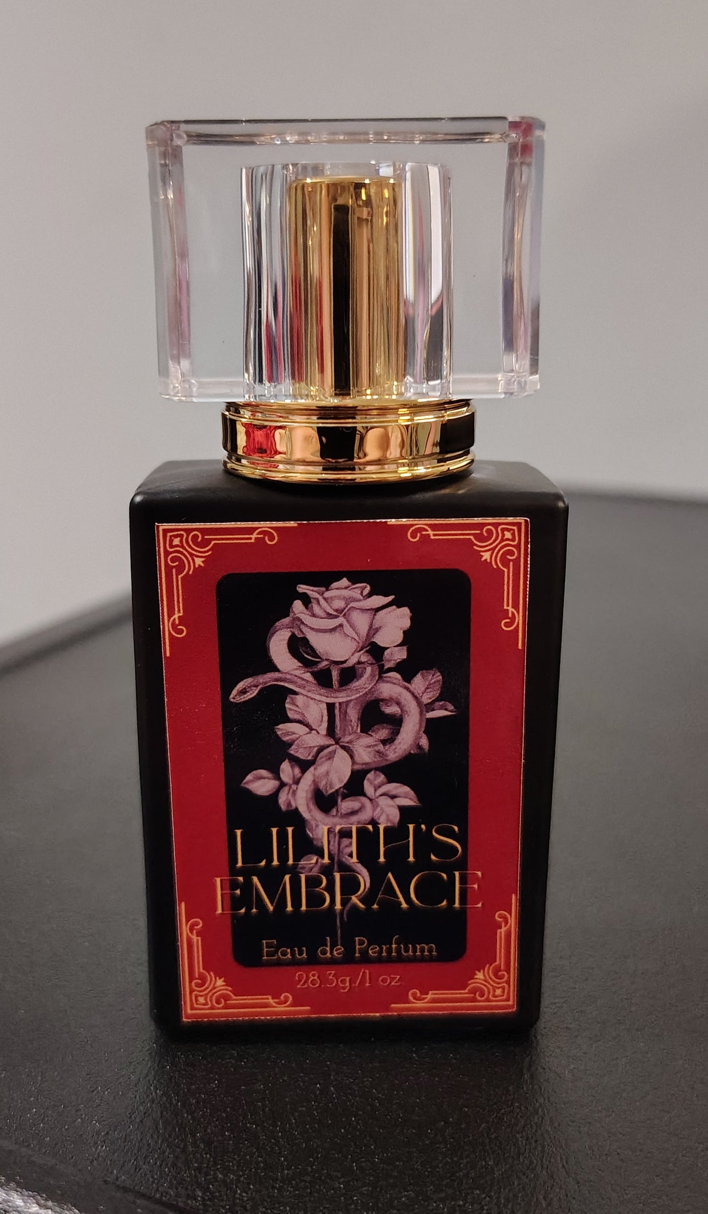 Lilith’s Embrace perfume in a 1 oz glass bottle, handcrafted in Sioux Falls, SD with dark feminine scent notes.