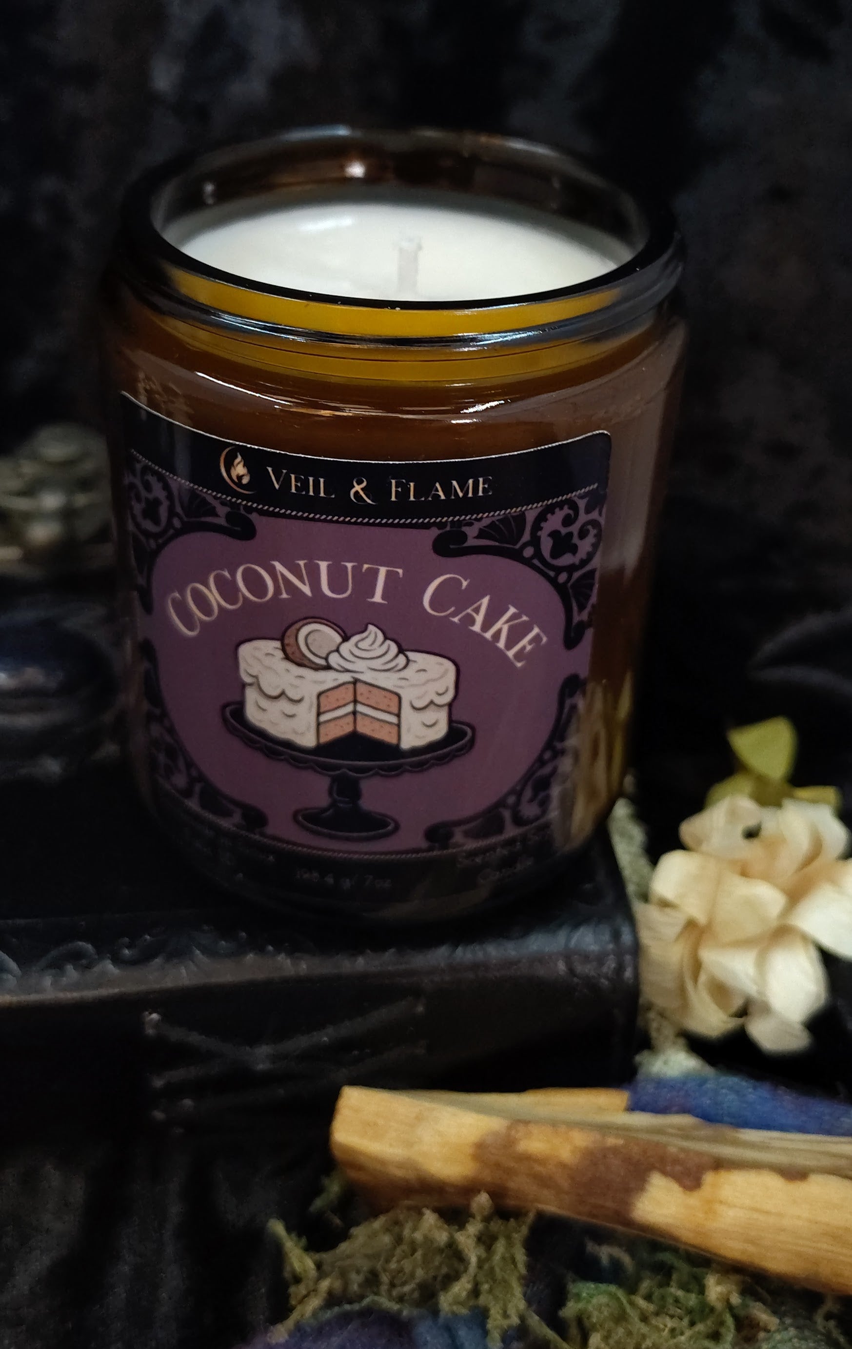 Coconut Cake candle in a 7 oz amber jar, handmade in Sioux Falls, SD with coconut milk, caramel, and vanilla scent notes.