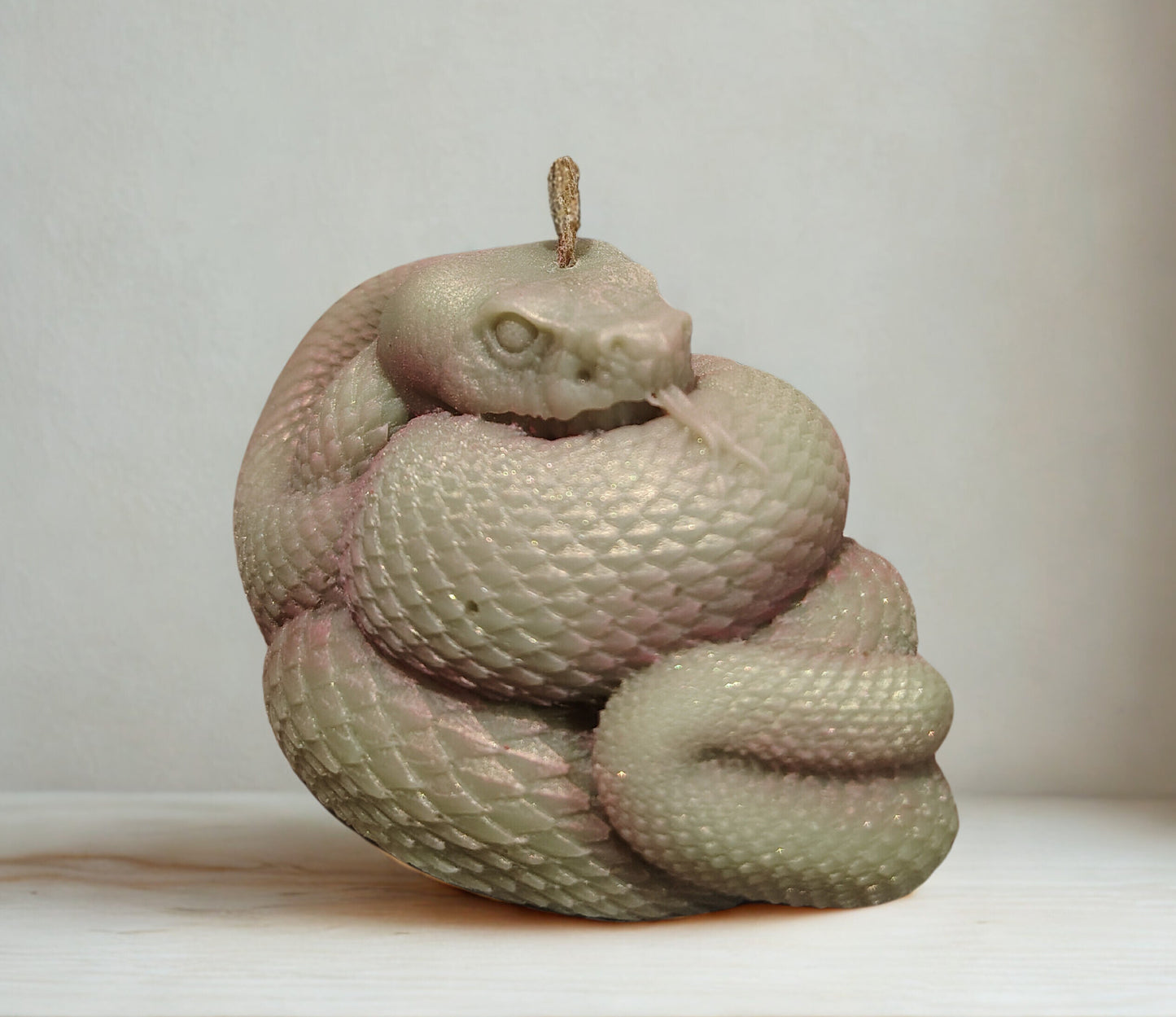 Coiled snake candle with detailed serpent design, handmade in Sioux Falls, SD.