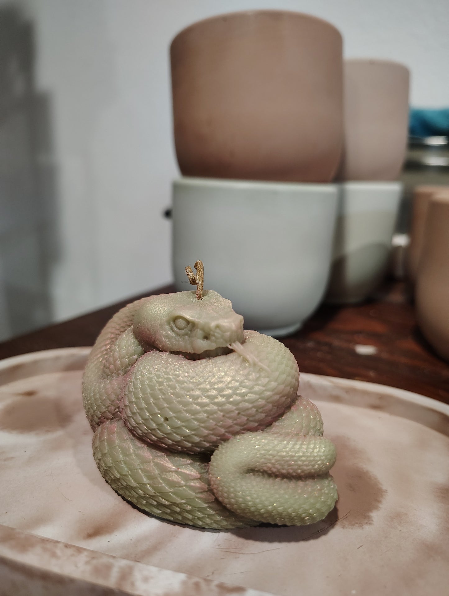 Coiled snake candle with detailed serpent design, handmade in Sioux Falls, SD.