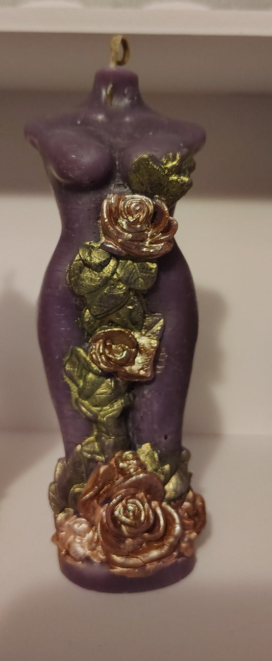 Purple feminine figure candle with bronze floral detailing, handmade in Sioux Falls, SD.
