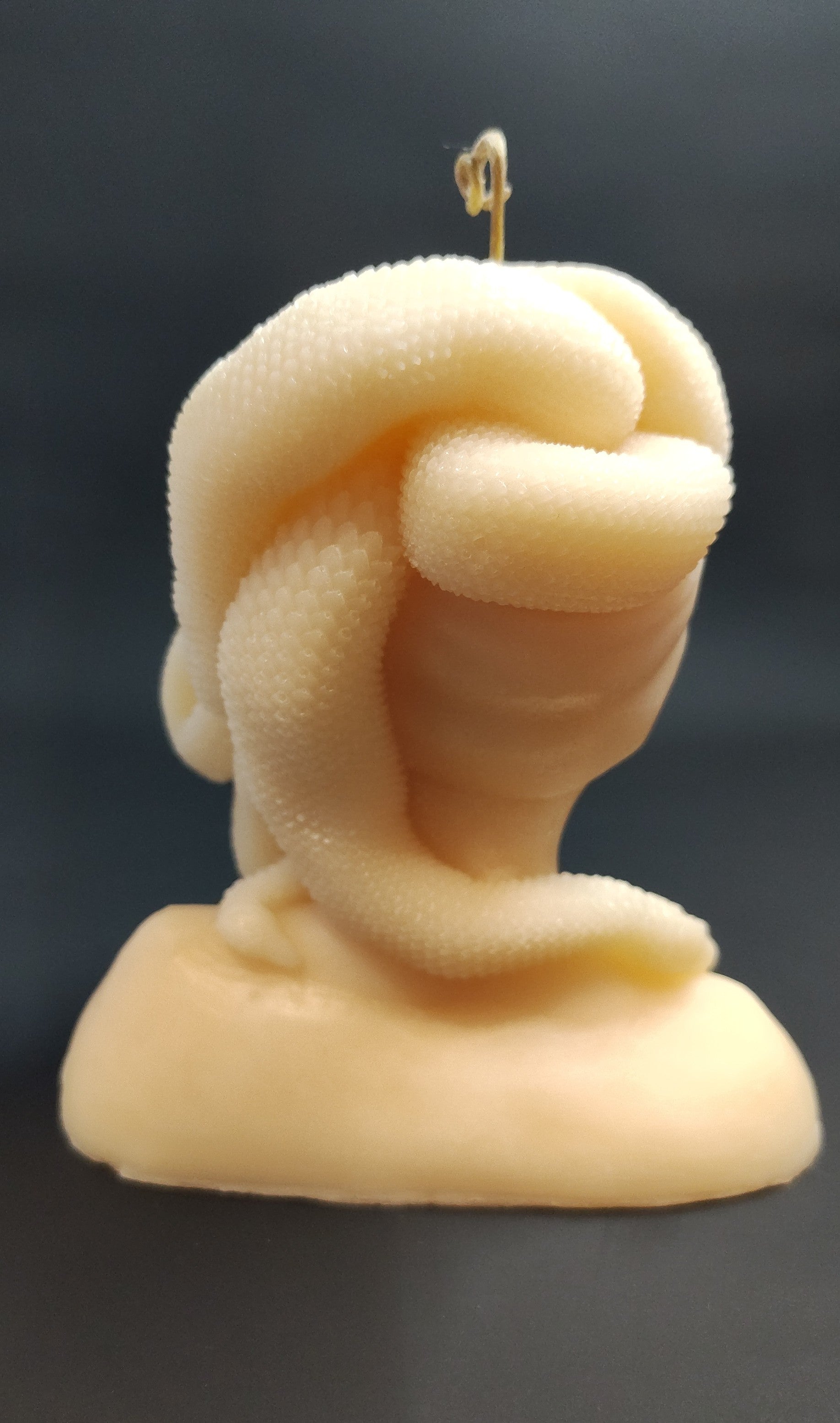 Hand‑poured Medusa bust candle with sculptural detailing, made in Sioux Falls, SD.