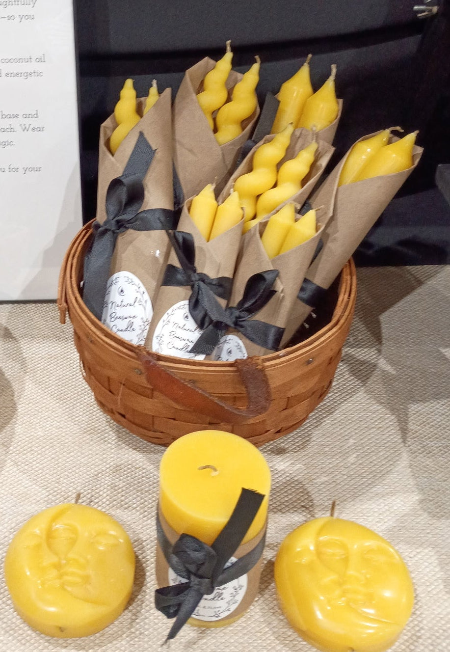 Pure beeswax candles in taper, chime, and Sun/Moon designs, hand‑poured in Sioux Falls, SD.