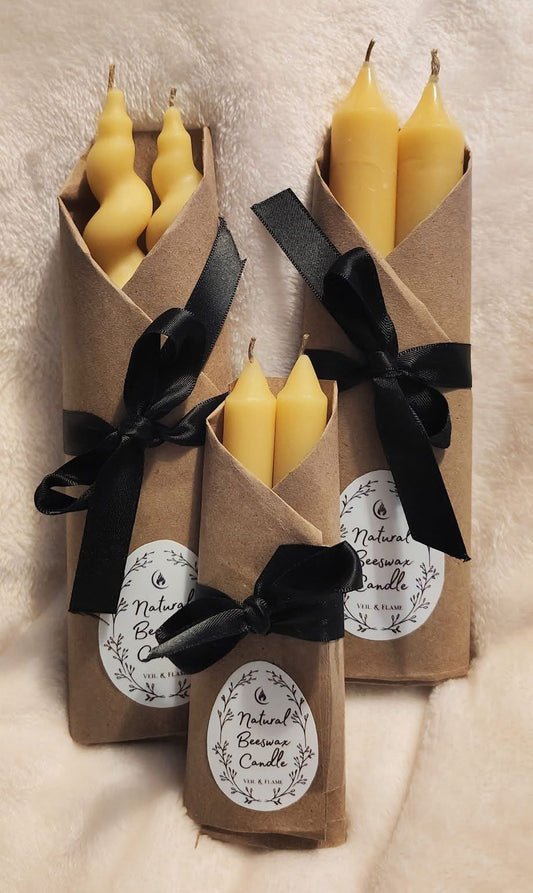 Pure beeswax candles in taper, chime, and Sun/Moon designs, hand‑poured in Sioux Falls, SD.