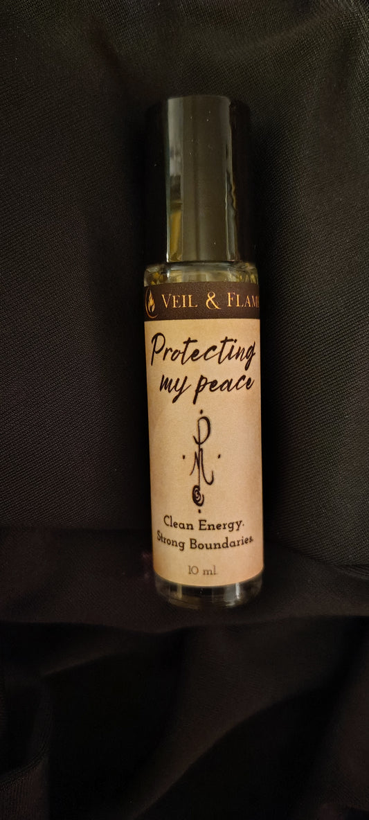 Protecting My Peace ritual oil with lavender, rosemary, bay‑leaf sigil, and obsidian chip in a 1 oz dropper bottle.