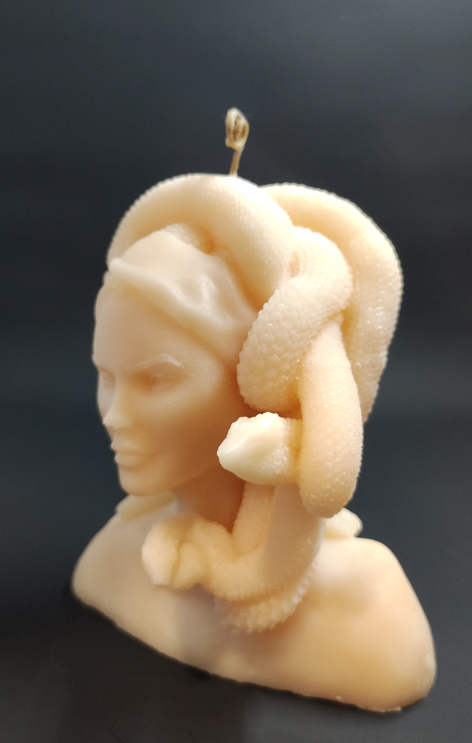 Hand‑poured Medusa bust candle with sculptural detailing, made in Sioux Falls, SD.