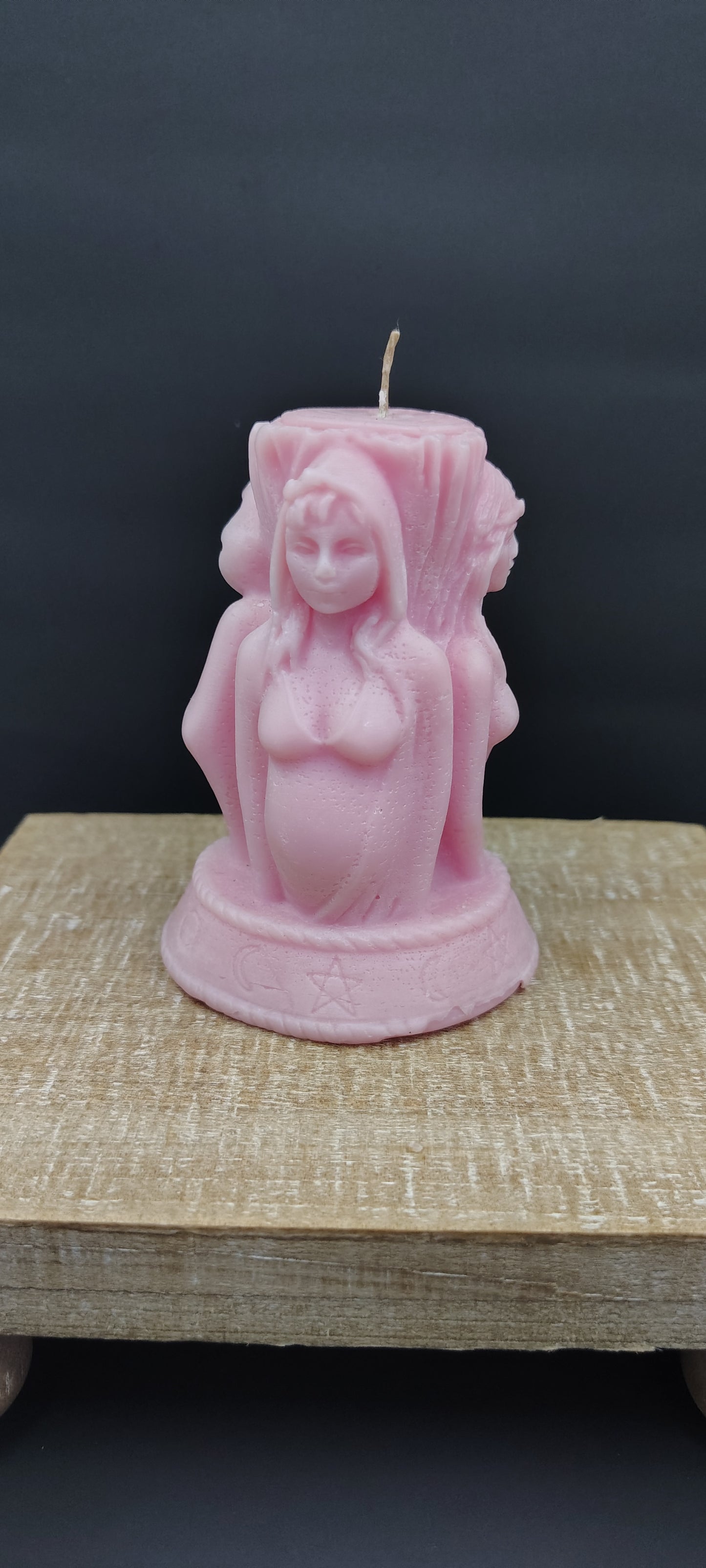Triple Goddess sculptural candle showing Maiden, Mother, and Crone figures, handmade in Sioux Falls, SD.