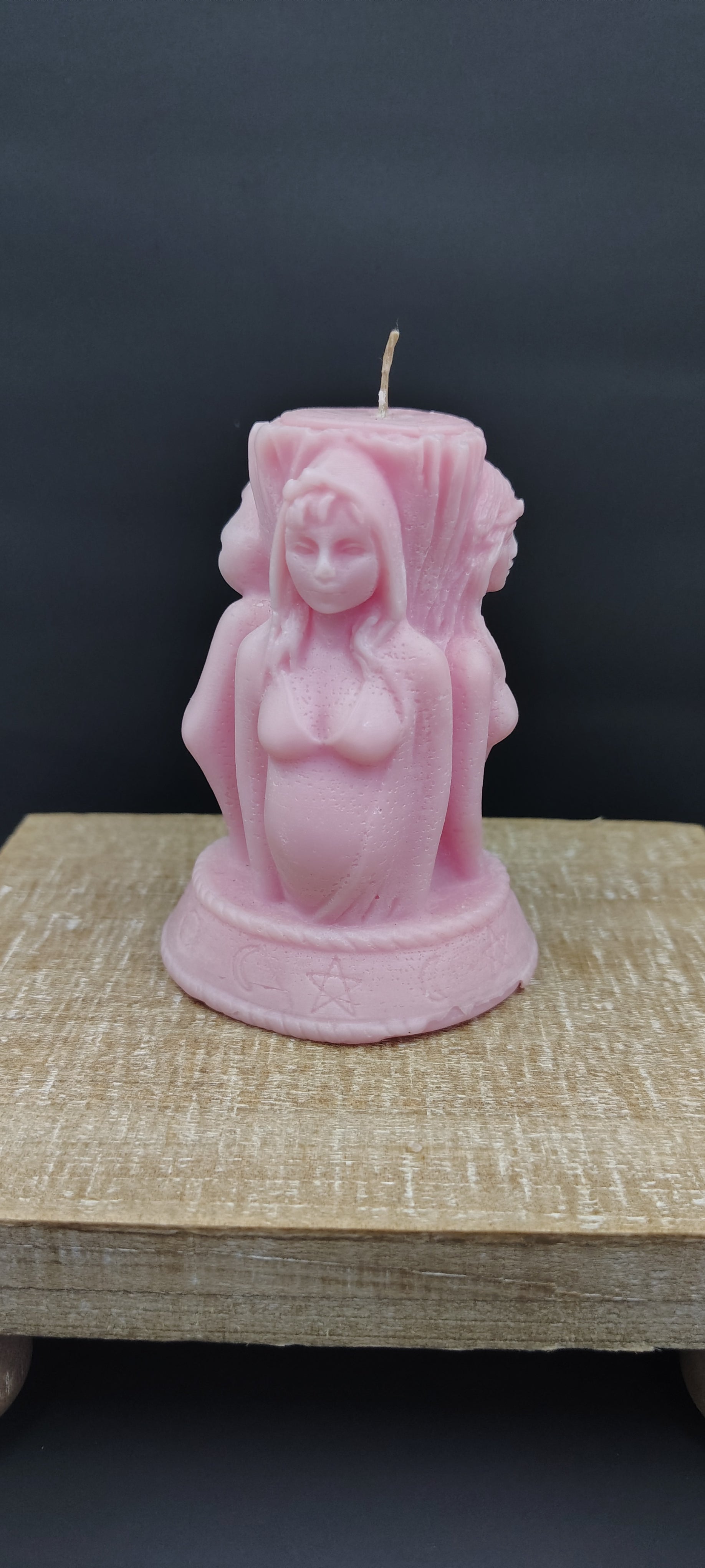 Triple Goddess sculptural candle showing Maiden, Mother, and Crone figures, handmade in Sioux Falls, SD.