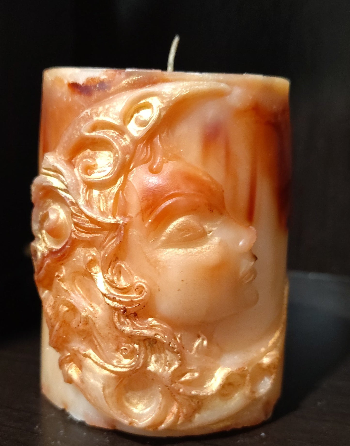 Sculptural moon‑themed feminine figure candle with marbled wax and gold detailing, handmade in Sioux Falls, SD.