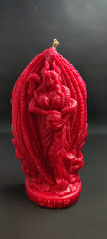Red decorative Lilith candle with intricate designs on a black background